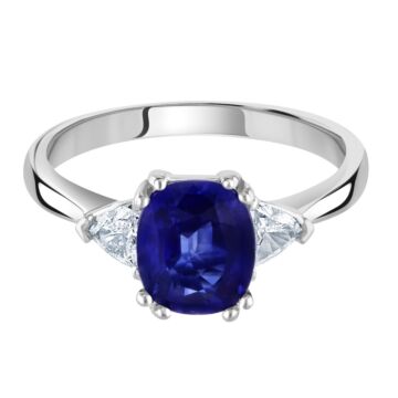 18ct white gold oval sapphire and trillion diamond 3 stone ring. Sapphire =2.45carat. Diamonds =0.30carat.